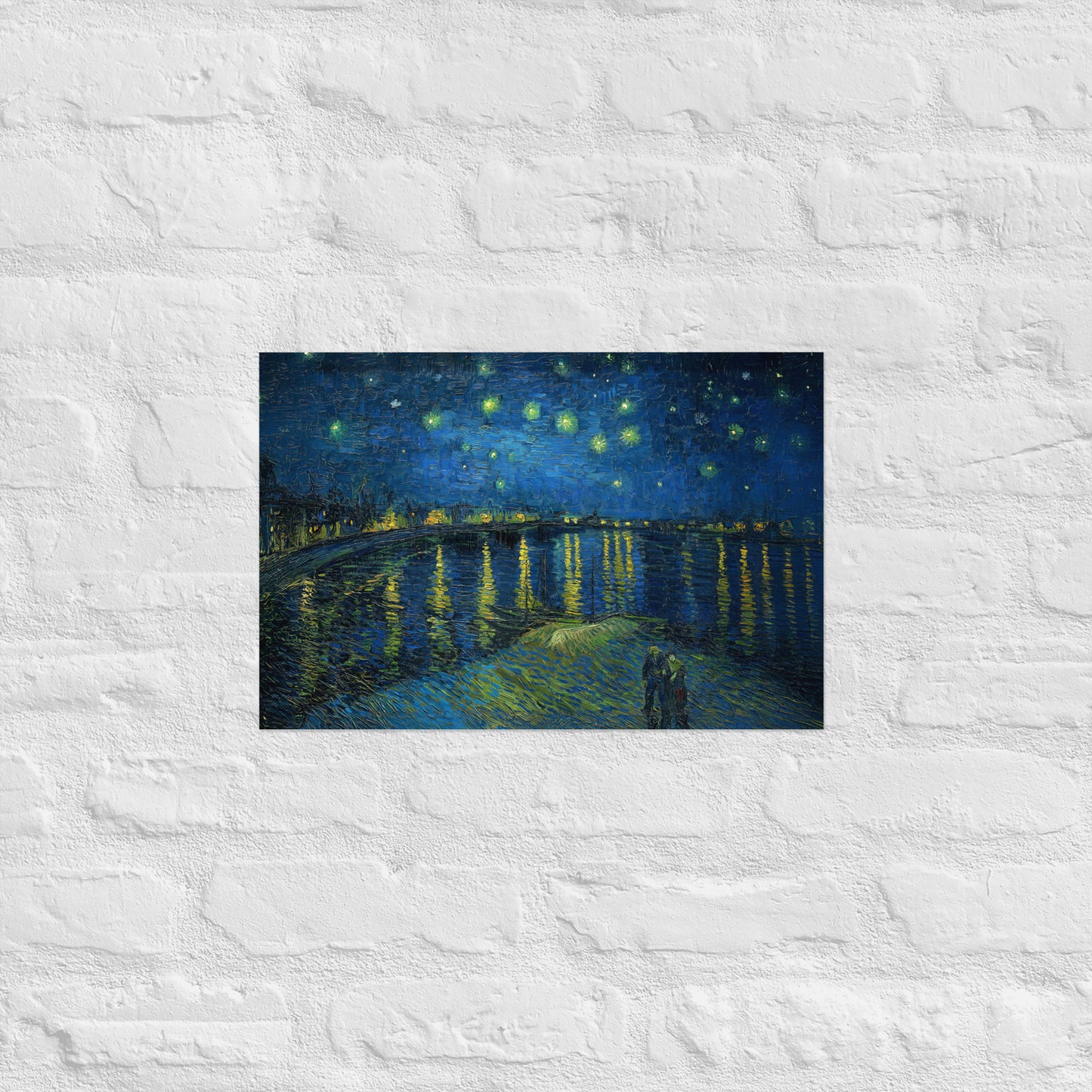 Van Gogh's 'Starry Night Over the Rhone' on a 12"x18" unframed poster print on a white brick wall.