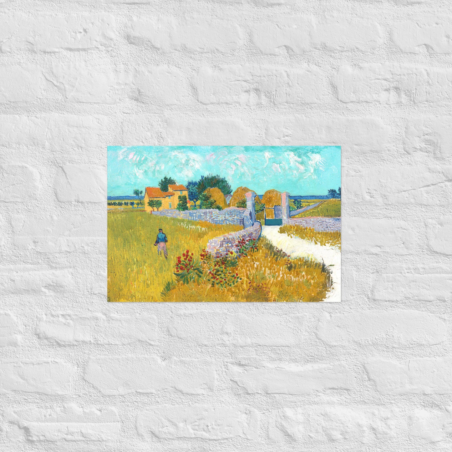 Van Gogh's 'Farmhouse in Provence' on a 12"x18" unframed poster print on a white brick wall.