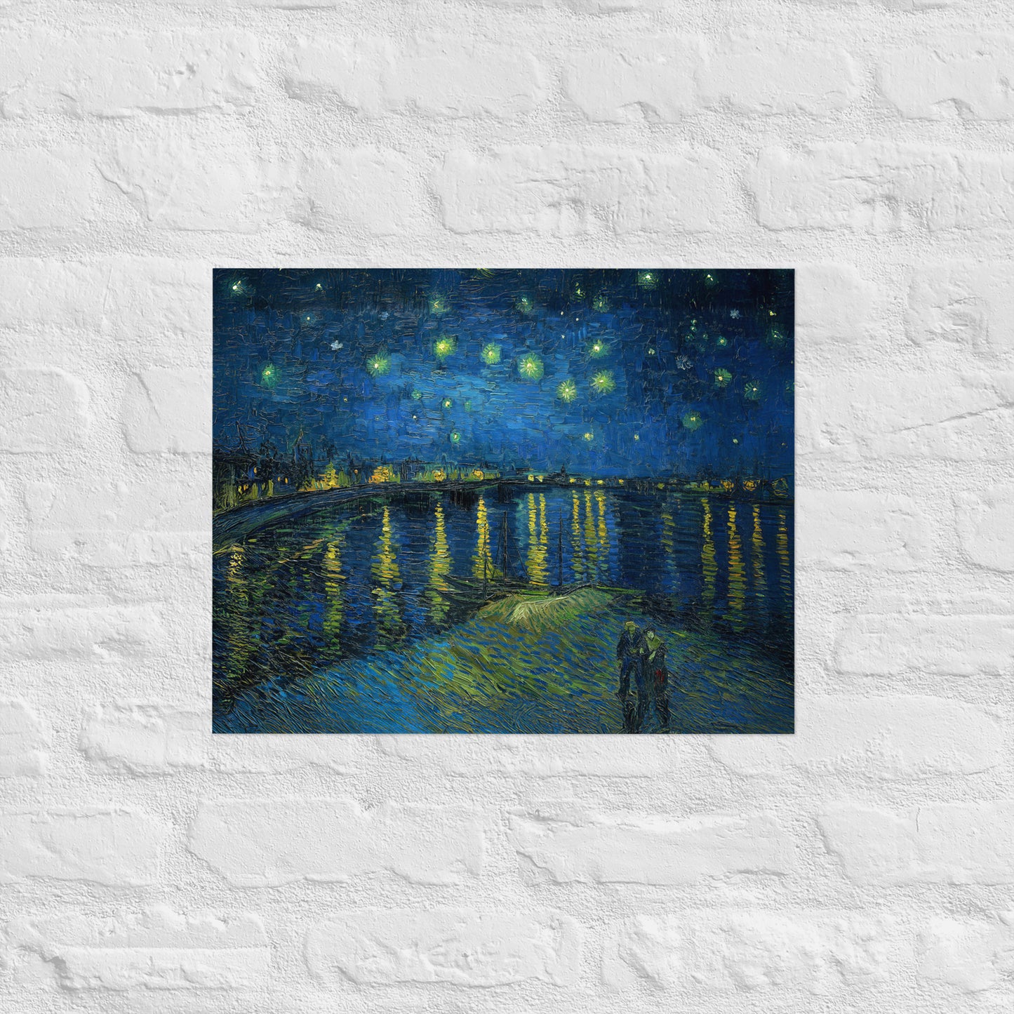 Van Gogh's 'Starry Night Over the Rhone' on a 16"x20" unframed poster print on a white brick wall.