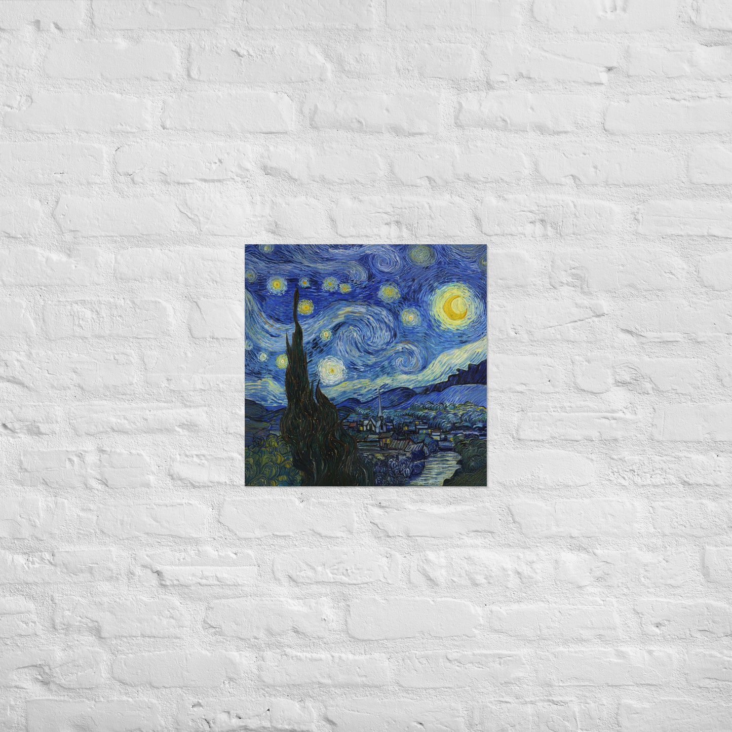 Van Gogh's 'Starry Night' on a 18"x18" unframed poster print on a white brick wall.