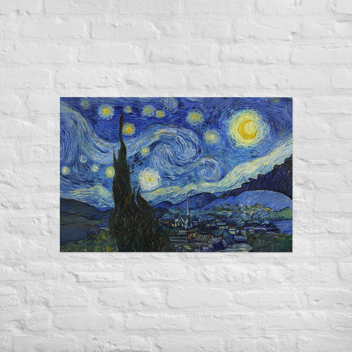 Van Gogh's 'Starry Night' on a 24"x36" unframed poster print on a white brick wall.