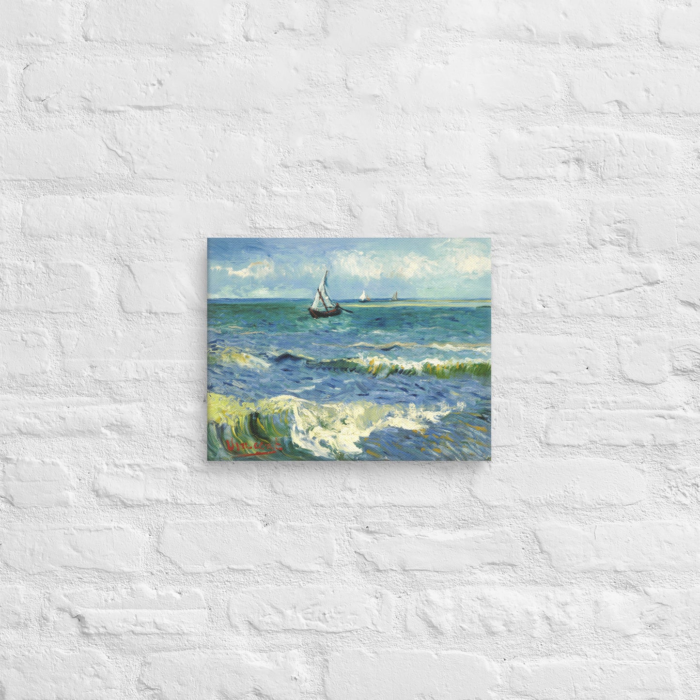 Van Gogh's 'The Sea at Les Saintes-Maries-de-la-Mer' on a 11"x14" unframed canvas print on a white brick wall.