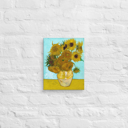 Van Gogh's 'Vase with Twelve Sunflowers' on a 11"x14" unframed canvas print on a white brick wall.