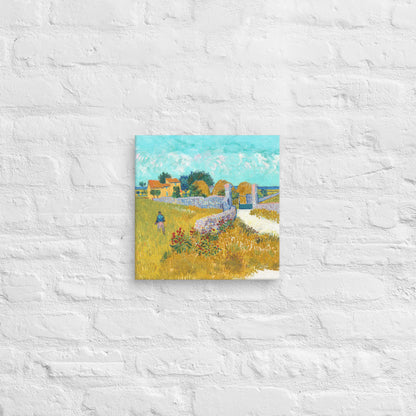 Van Gogh's 'Farmhouse in Provence' on a 12"x12" unframed canvas print on a white brick wall.