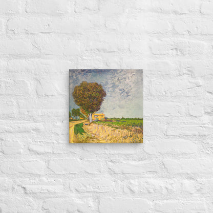Van Gogh's 'A Lane near Arles' on a 12"x12" unframed canvas print on a white brick wall.