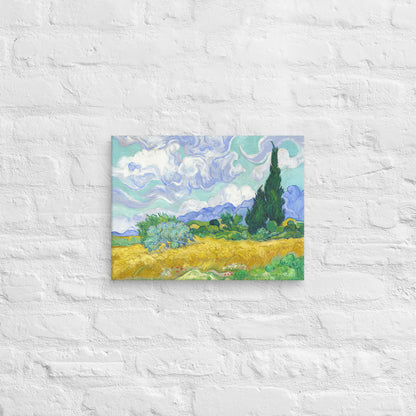 Van Gogh's 'Wheat Field with Cypresses' on a 12"x16" unframed canvas print on a white brick wall.