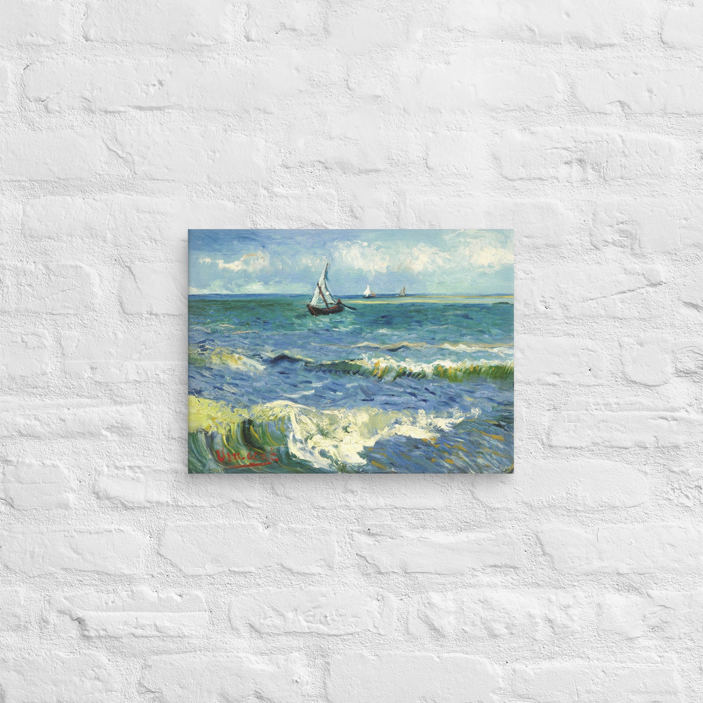 Van Gogh's 'The Sea at Les Saintes-Maries-de-la-Mer' on a 12"x16" unframed canvas print on a white brick wall.