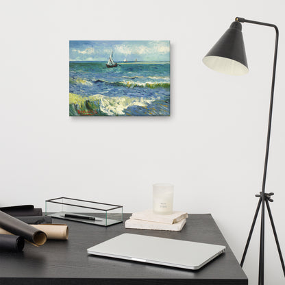 Van Gogh's 'The Sea at Les Saintes-Maries-de-la-Mer' on a 12"x16" unframed canvas print on a white wall above a modern office desk, lamp, and assorted desk items.