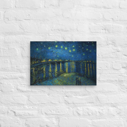 Van Gogh's 'Starry Night Over the Rhone' on a 12"x18" unframed canvas print on a white brick wall.