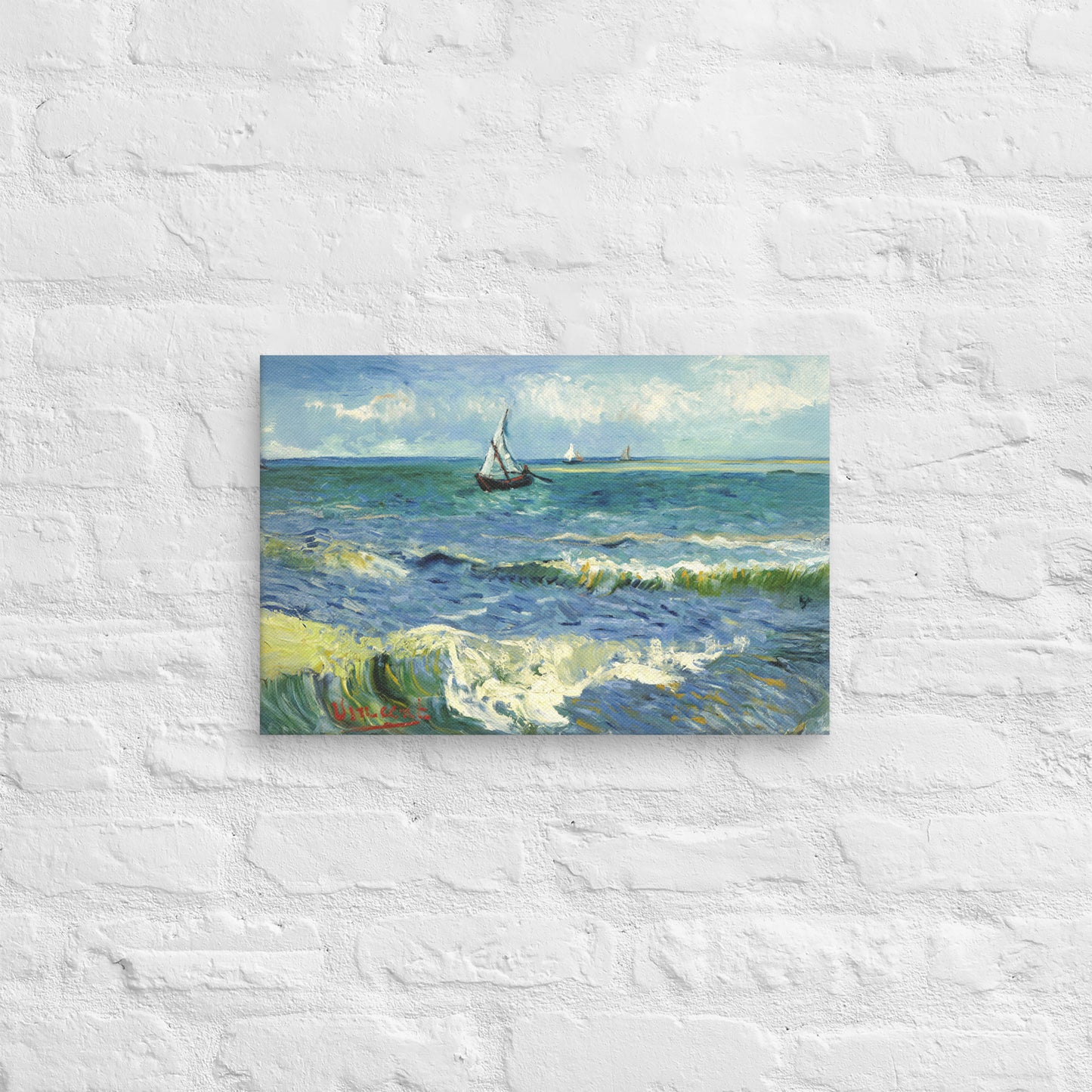 Van Gogh's 'The Sea at Les Saintes-Maries-de-la-Mer' on a 12"x18" unframed canvas print on a white brick wall.