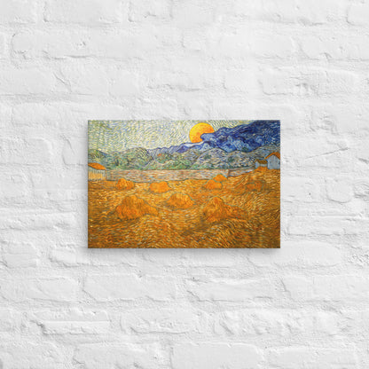 Van Gogh's 'Landscape with Wheat Sheaves and Rising Moon' on a 12"x18" unframed canvas print on a white brick wall.
