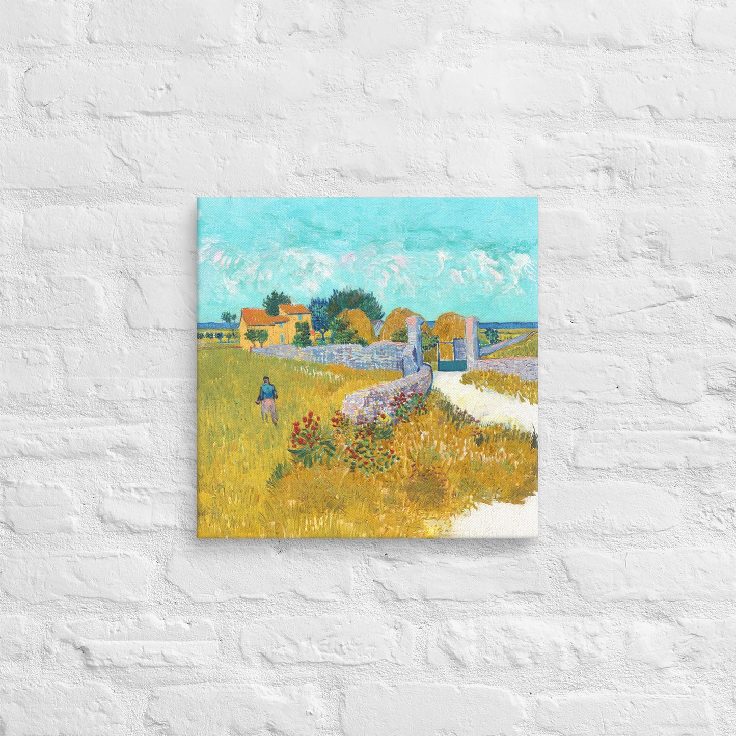 Van Gogh's 'Farmhouse in Provence' on a 16"x16" unframed canvas print on a white brick wall.