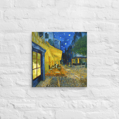 Van Gogh's 'Café Terrace at Night' on a 16"x16" unframed canvas print on a white brick wall.