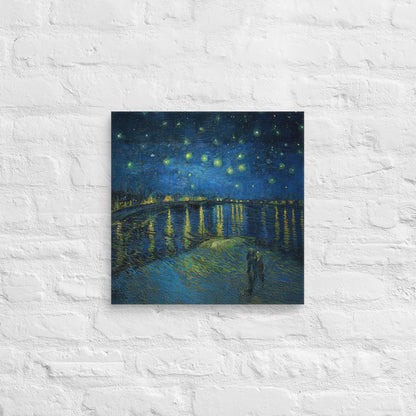 Van Gogh's 'Starry Night Over the Rhone' on a 16"x16" unframed canvas print on a white brick wall.