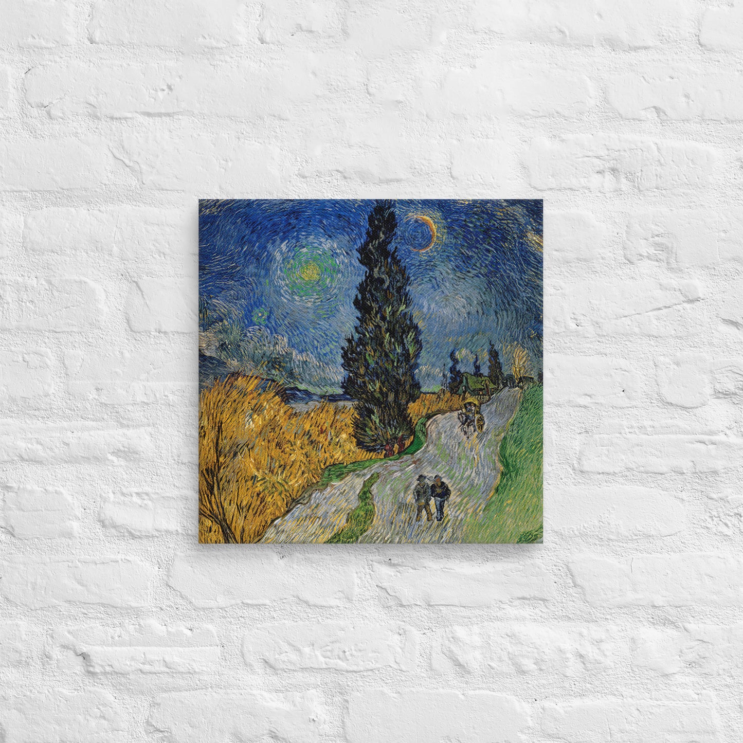Van Gogh's 'Road with Cypress and Star' on a 16"x16" unframed canvas print on a white brick wall.