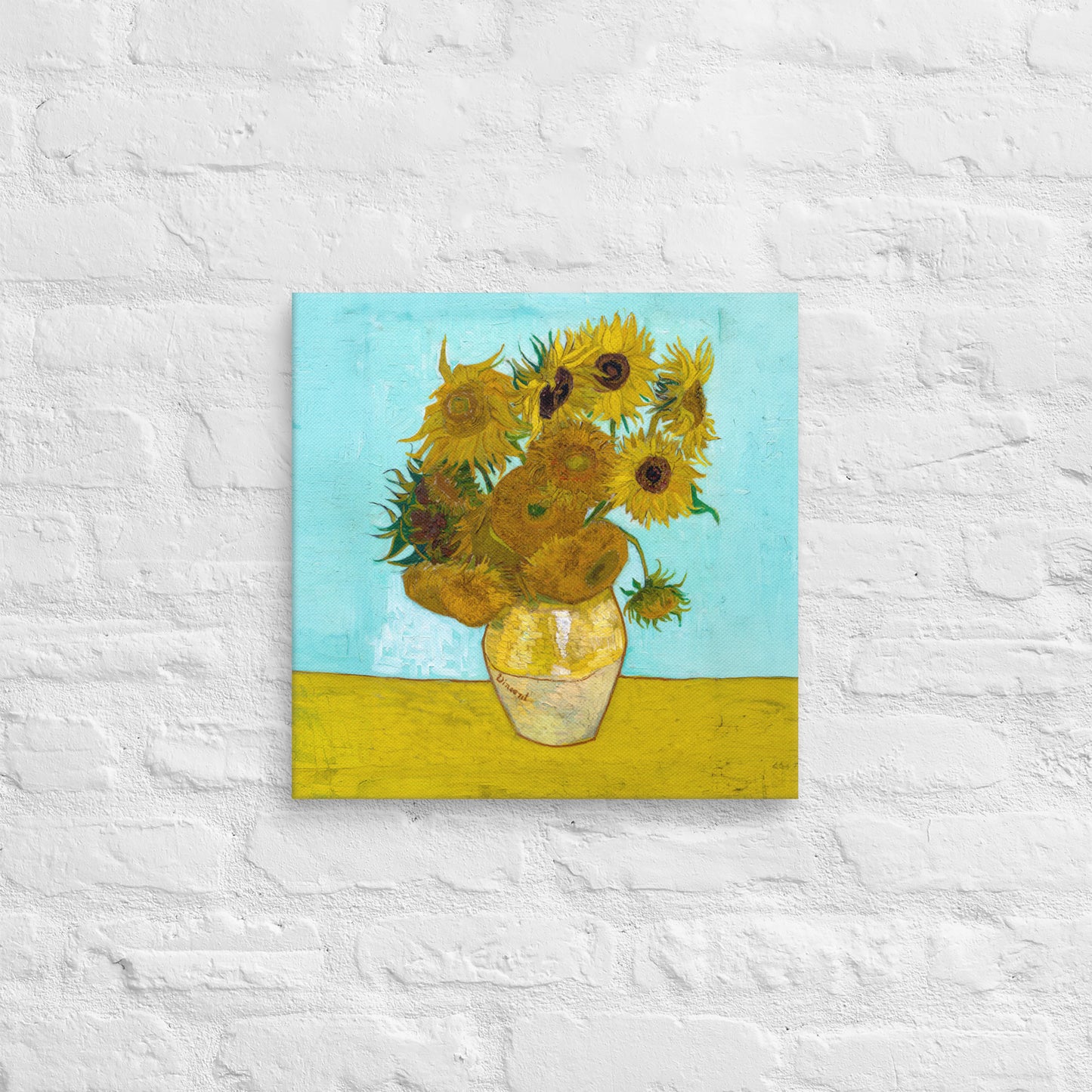 Van Gogh's 'Vase with Twelve Sunflowers' on a 16"x16" unframed canvas print on a white brick wall.