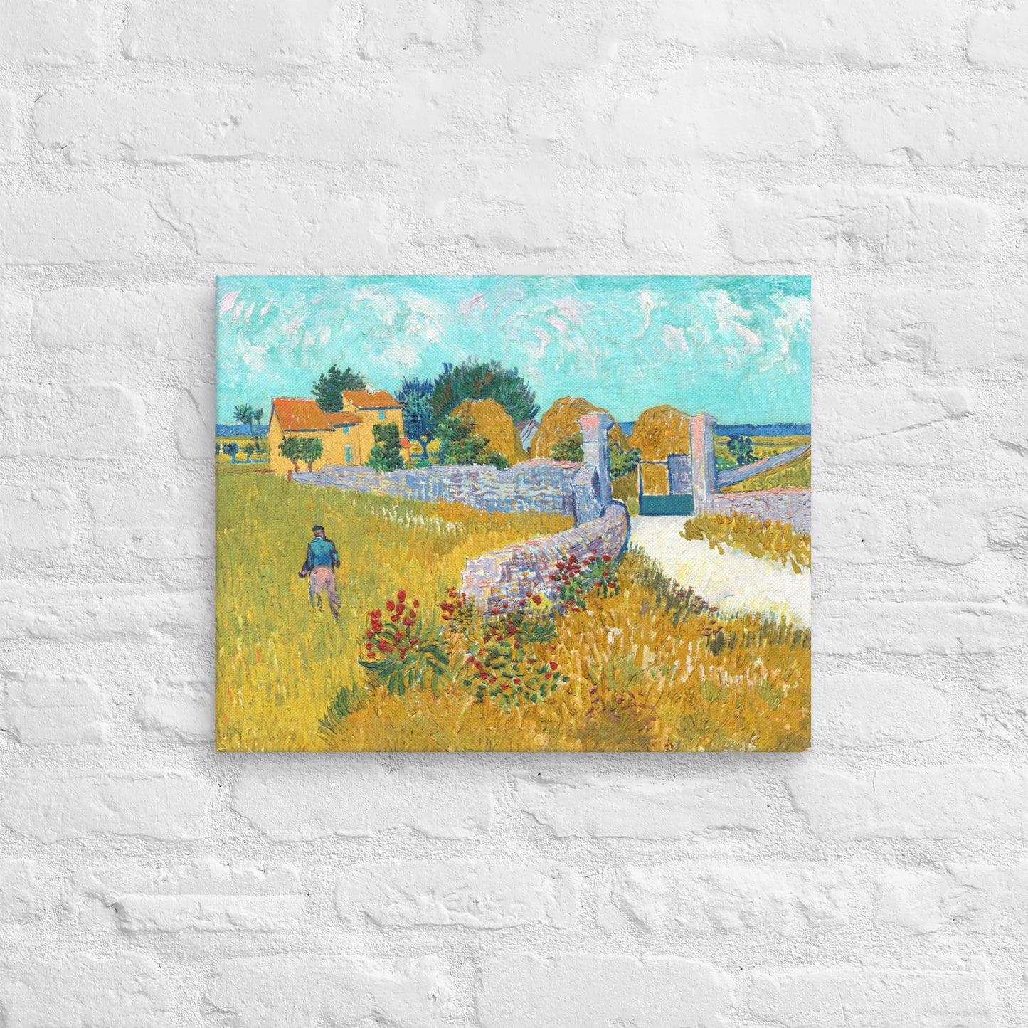 Van Gogh's 'Farmhouse in Provence' on a 16"x20" unframed canvas print on a white brick wall.