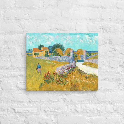 Van Gogh's 'Farmhouse in Provence' on a 16"x20" unframed canvas print on a white brick wall.