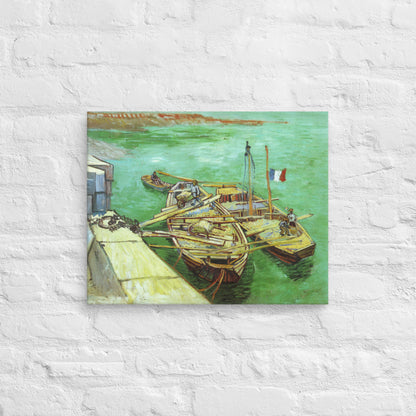 Van Gogh's 'Quay with Men Unloading Sand Barges' on a 16"x20" unframed canvas print on a white brick wall.