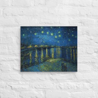 Van Gogh's 'Starry Night Over the Rhone' on a 16"x20" unframed canvas print on a white brick wall.