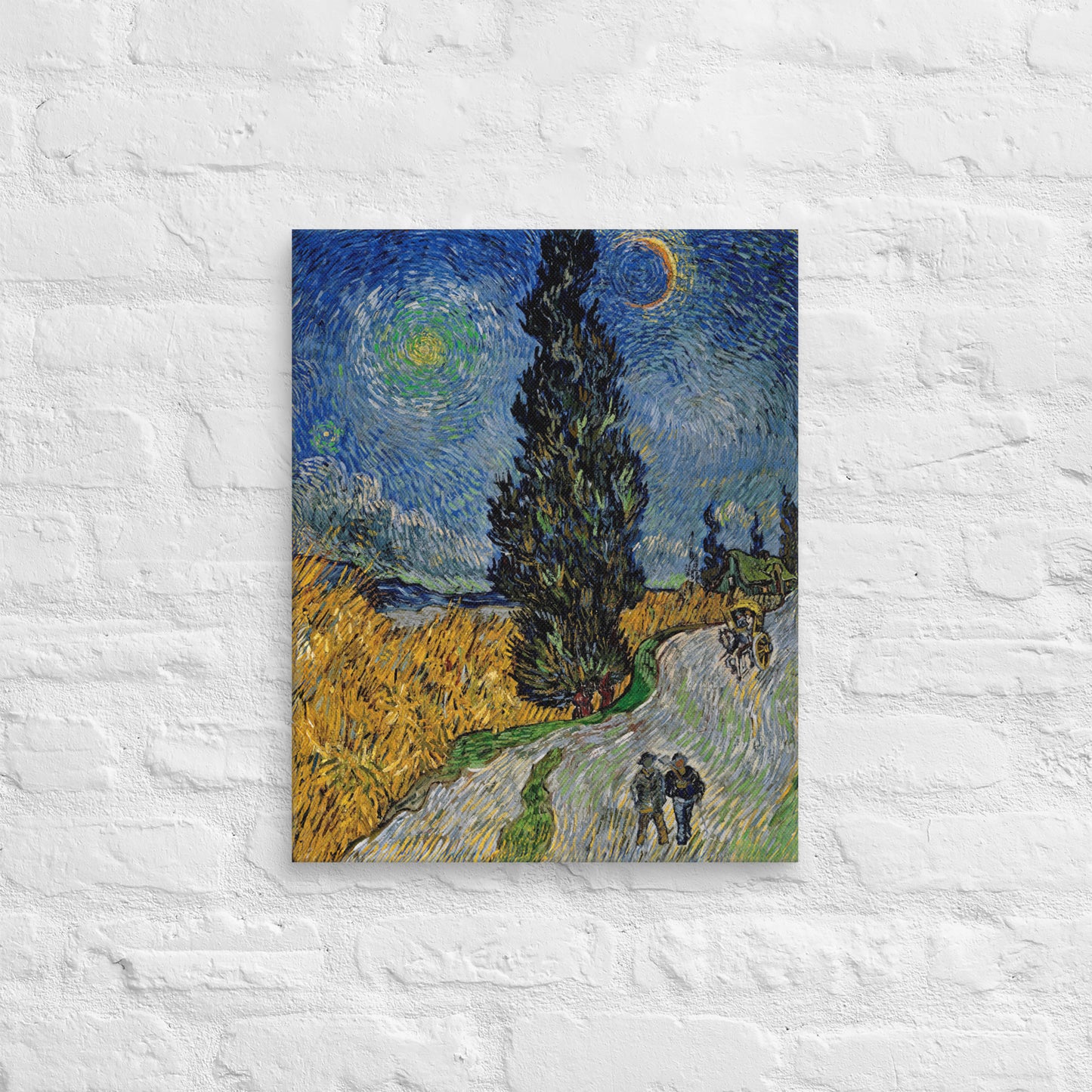 Van Gogh's 'Road with Cypress and Star' on a 16"x20" unframed canvas print on a white brick wall.