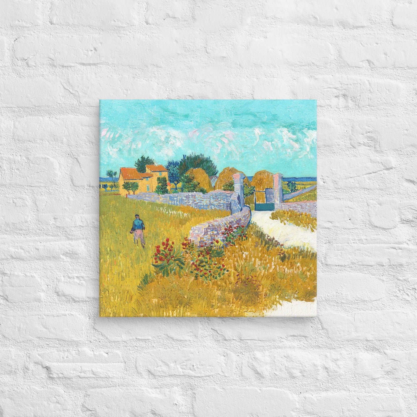 Van Gogh's 'Farmhouse in Provence' on a 18"x18" unframed canvas print on a white brick wall.