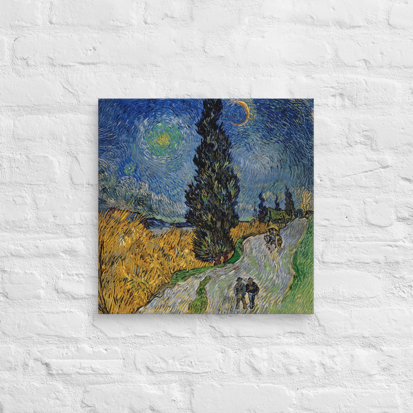 Van Gogh's 'Road with Cypress and Star' on a 18"x18" unframed canvas print on a white brick wall.
