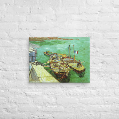 Van Gogh's 'Quay with Men Unloading Sand Barges' on a 18"x24" unframed canvas print on a white brick wall.