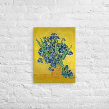Van Gogh's 'Vase with Irises Against a Yellow Background' on a 18"x24" unframed canvas print on a white brick wall.