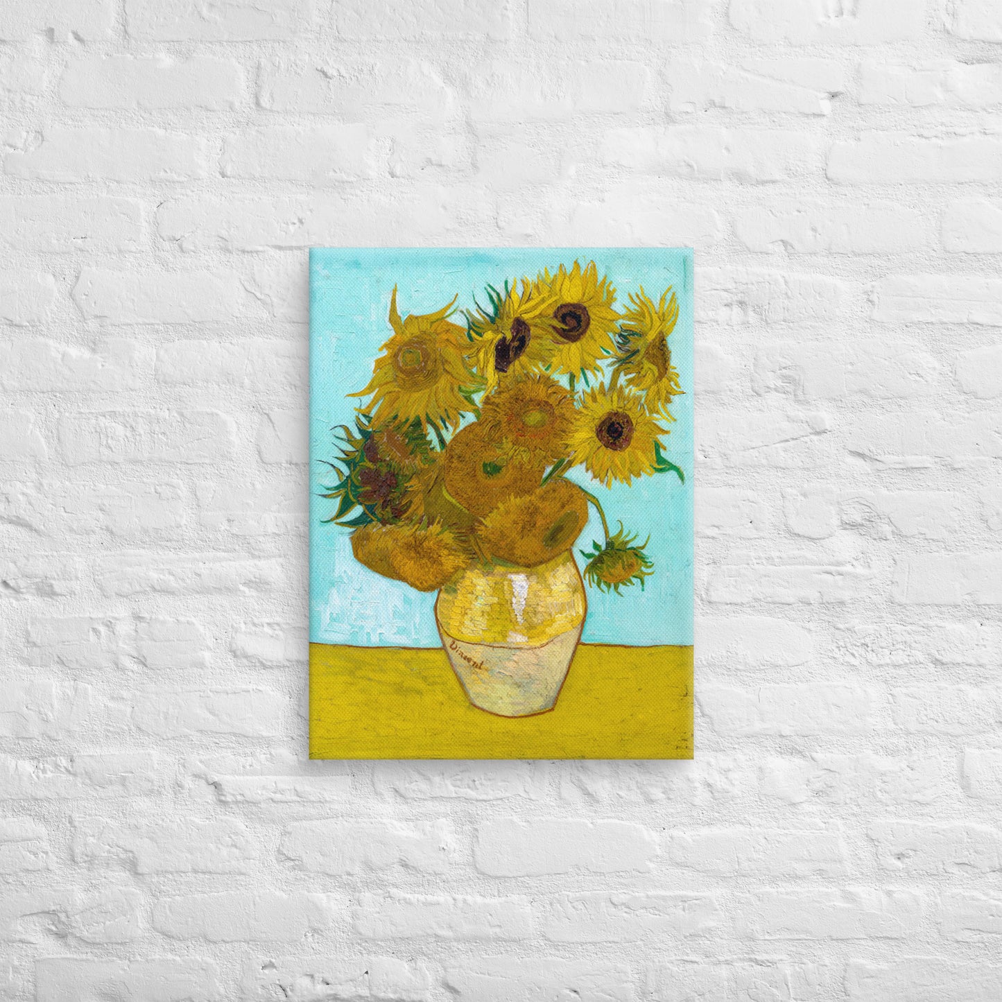 Van Gogh's 'Vase with Twelve Sunflowers' on a 18"x24" unframed canvas print on a white brick wall.