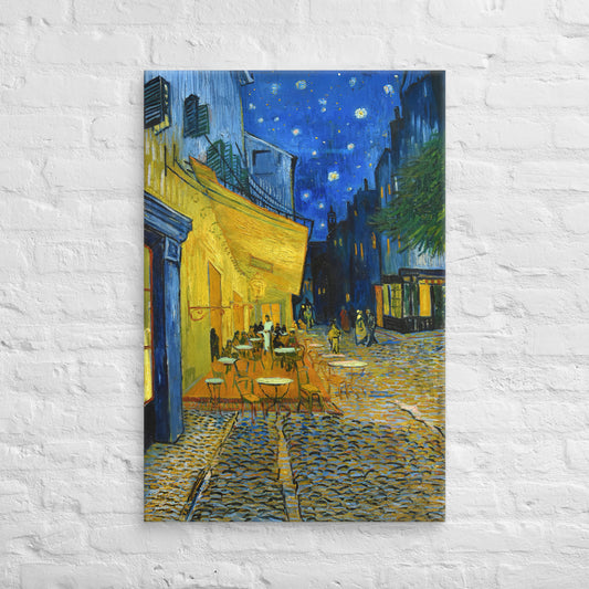 Van Gogh's 'Café Terrace at Night' on a 24"x36" unframed canvas print on a white brick wall.