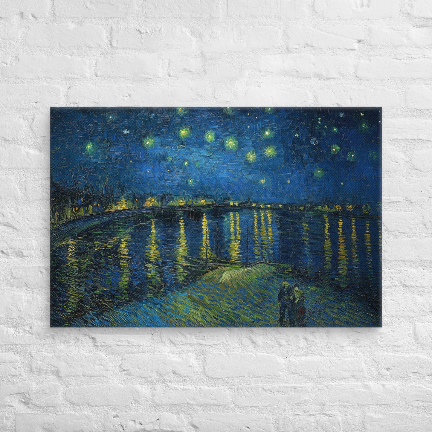Van Gogh's 'Starry Night Over the Rhone' on a 24"x36" unframed canvas print on a white brick wall.