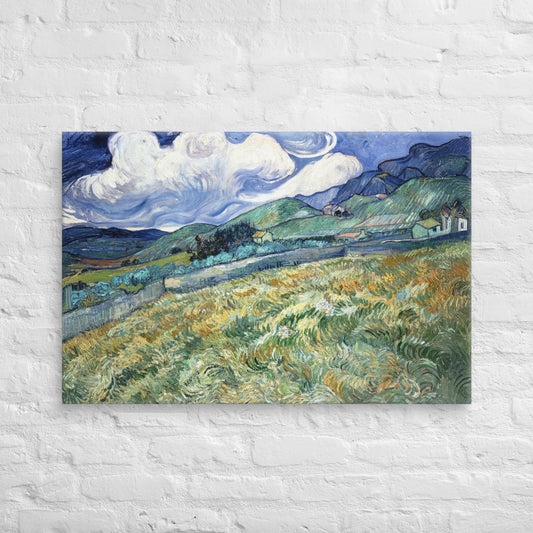 Van Gogh's 'Landscape from Saint-Rémy' on a 24"x36" unframed canvas print on a white brick wall.