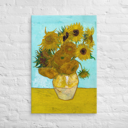 Van Gogh's 'Vase with Twelve Sunflowers' on a 24"x36" unframed canvas print on a white brick wall.