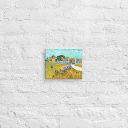 Van Gogh's 'Farmhouse in Provence' on a 8"x10" unframed canvas print on a white brick wall.