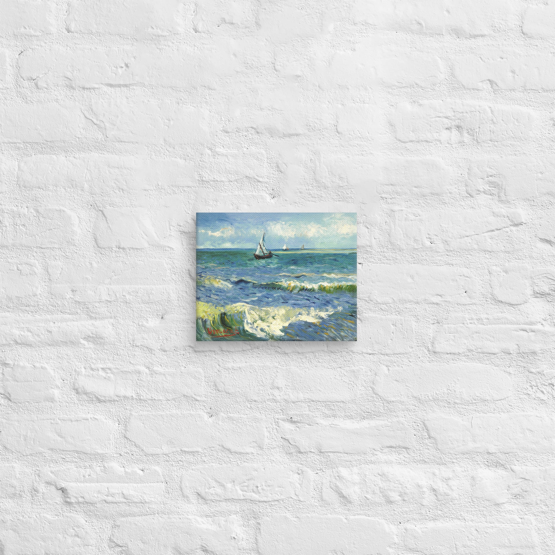 Van Gogh's 'The Sea at Les Saintes-Maries-de-la-Mer' on a 8"x10" unframed canvas print on a white brick wall.