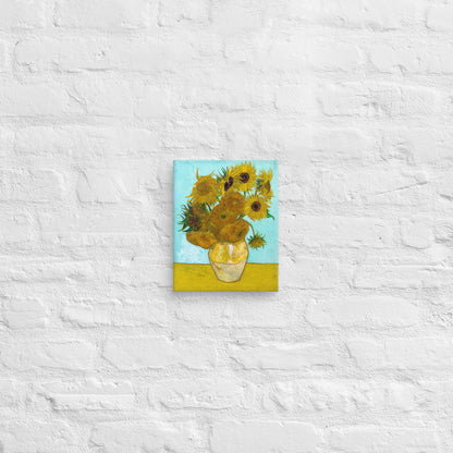 Van Gogh's 'Vase with Twelve Sunflowers' on a 8"x10" unframed canvas print on a white brick wall.