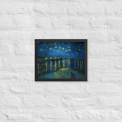 Van Gogh's 'Starry Night Over the Rhone' on a 11"x14" black framed poster print on a white brick wall.