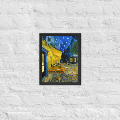 Van Gogh's 'Café Terrace at Night' on a 11"x14" black framed poster print on a white brick wall.