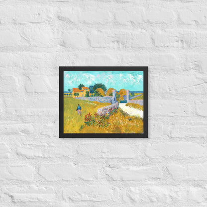 Van Gogh's 'Farmhouse in Provence' on a 11"x14" black framed poster print on a white brick wall.