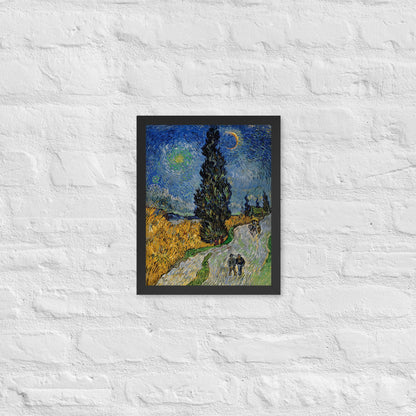 Van Gogh's 'Road with Cypress and Star' on a 11"x14" black framed poster print on a white brick wall.