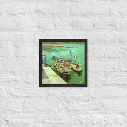 Van Gogh's 'Quay with Men Unloading Sand Barges' on a 12"x12" black framed poster print on a white brick wall.