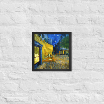 Van Gogh's 'Café Terrace at Night' on a 12"x12" black framed poster print on a white brick wall.