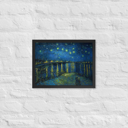 Van Gogh's 'Starry Night Over the Rhone' on a 12"x16" black framed poster print on a white brick wall.