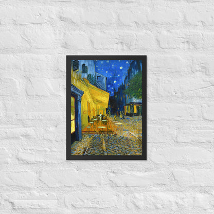 Van Gogh's 'Café Terrace at Night' on a 12"x16" black framed poster print on a white brick wall.