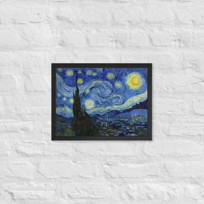 Van Gogh's 'Starry Night' on a 12"x16" black framed poster print on a white brick wall.