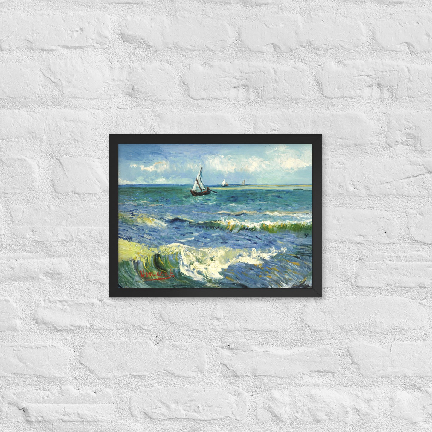 Van Gogh's 'The Sea at Les Saintes-Maries-de-la-Mer' on a 12"x16" black framed poster print on a white brick wall.