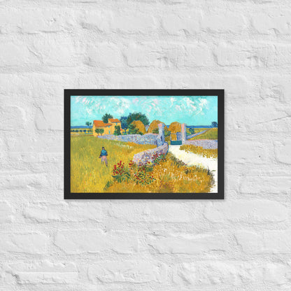 Van Gogh's 'Farmhouse in Provence' on a 12"x18" black framed poster print on a white brick wall.