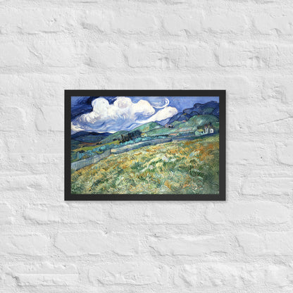 Van Gogh's 'Landscape from Saint-Rémy' on a 12"x18" black framed poster print on a white brick wall.