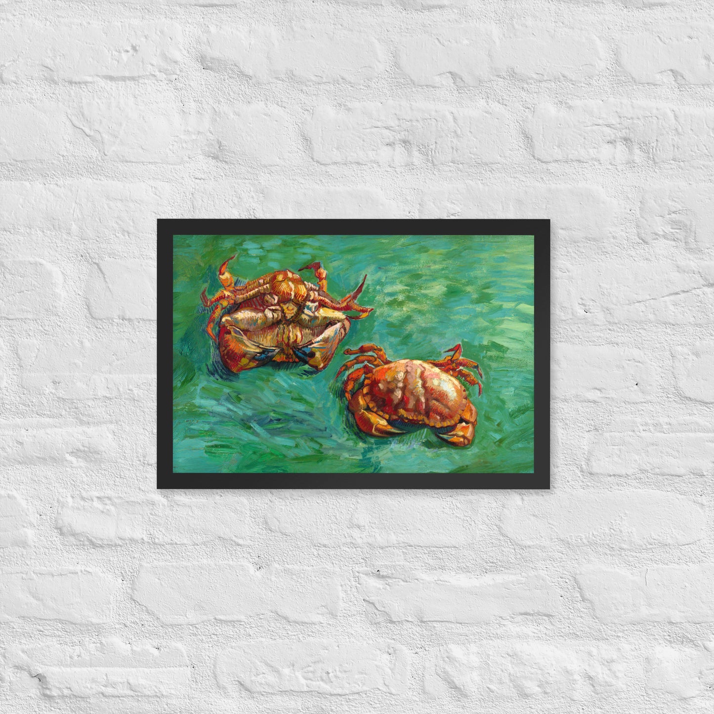 Van Gogh's 'Two Crabs' on a 12"x18" black framed poster print on a white brick wall.